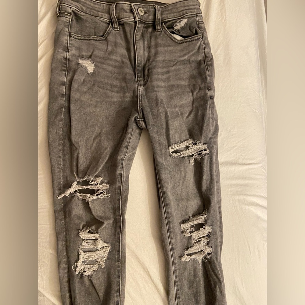 Next Level Stretch Gray ripped skinny jeans.